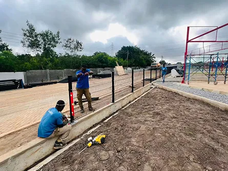 Wire mesh guardrail installation along a major highway in Ghana, enhancing road safety and aesthetics.