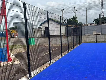 Close-up view of high-quality mesh fence material installed for highway expansion in Ghana, designed to withstand harsh climate and traffic.